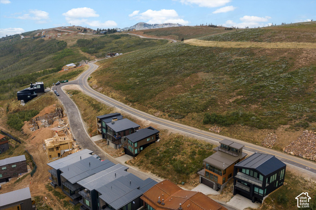 8456 Copper Crest Road, Unit 148 Eden, UT 84310 - Photo 2 of 34 Mountainous terrain with established roads, modern architectural homes, and ongoing construction