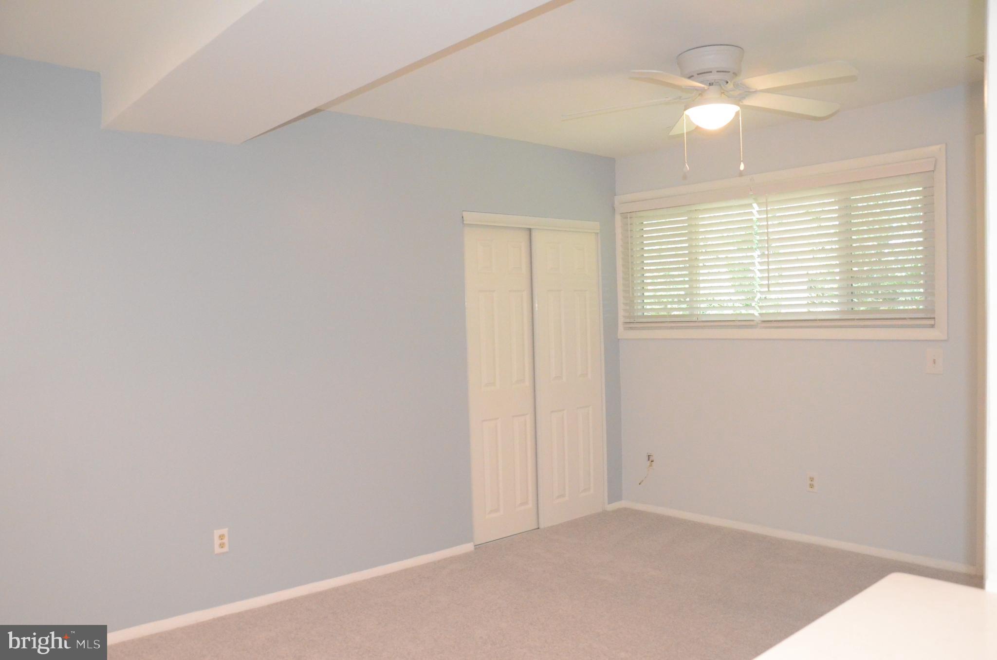 521 Epsom Road, Unit 2D Towson, MD 21286 - Photo 6 of 28 Living room with large closet new wall to wall