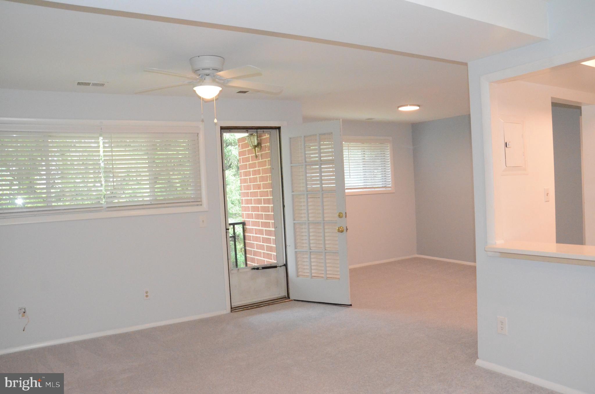 521 Epsom Road, Unit 2D Towson, MD 21286 - Photo 8 of 28 Living room flows into the dining area