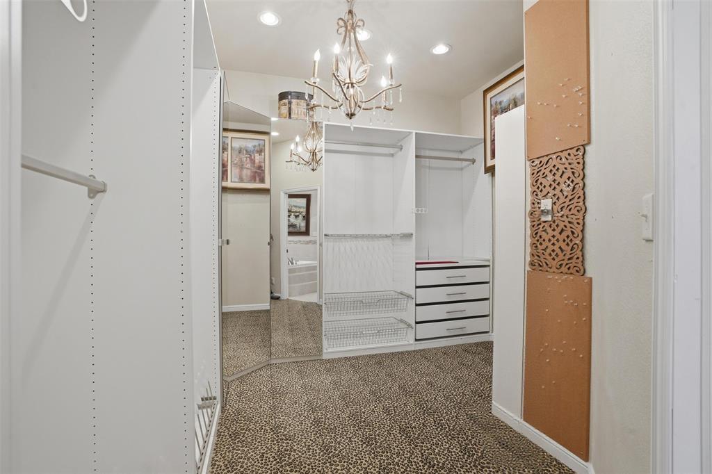 9651 Yellow Rose Lane Pilot Point, TX 76258 - Photo 23 of 38 a view of a hallway with chandelier and entryway