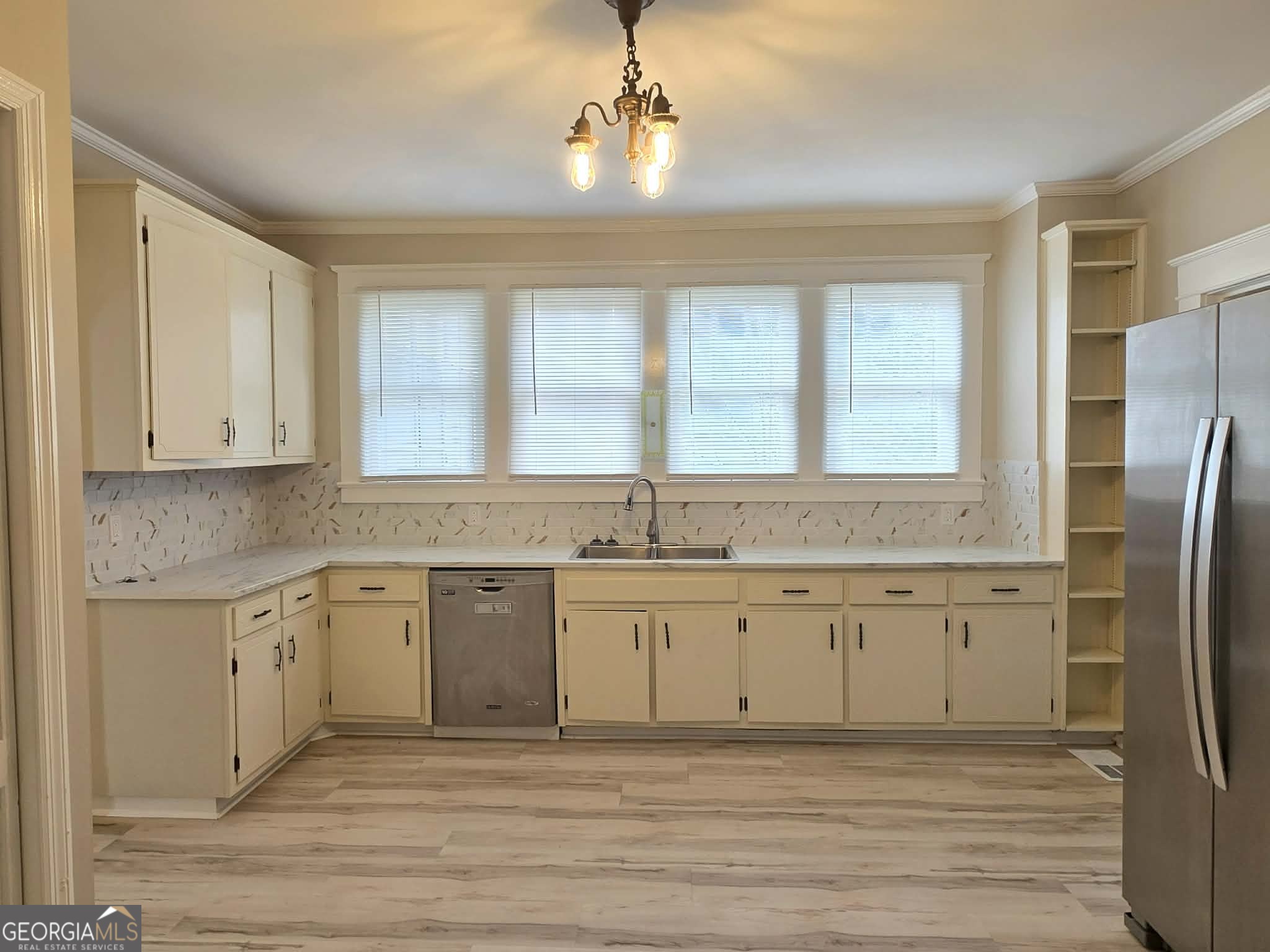 404 West Gordon Street Thomaston, GA 30286 - Photo 11 of 26 a kitchen with stainless steel appliances granite countertop a sink and cabinets
