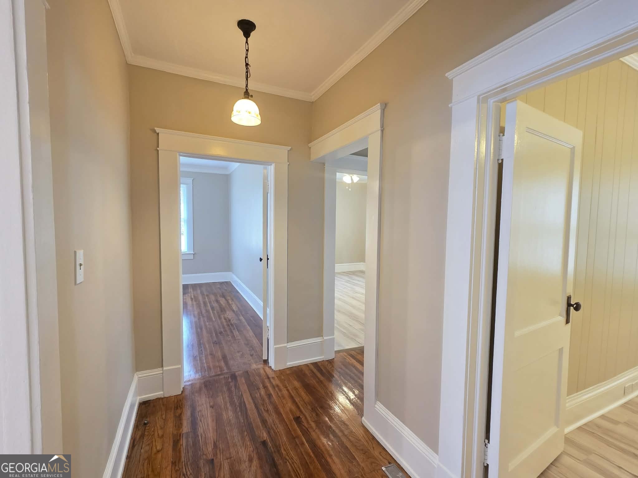 404 West Gordon Street Thomaston, GA 30286 - Photo 16 of 26 a view of a hallway with wooden floor and staircase