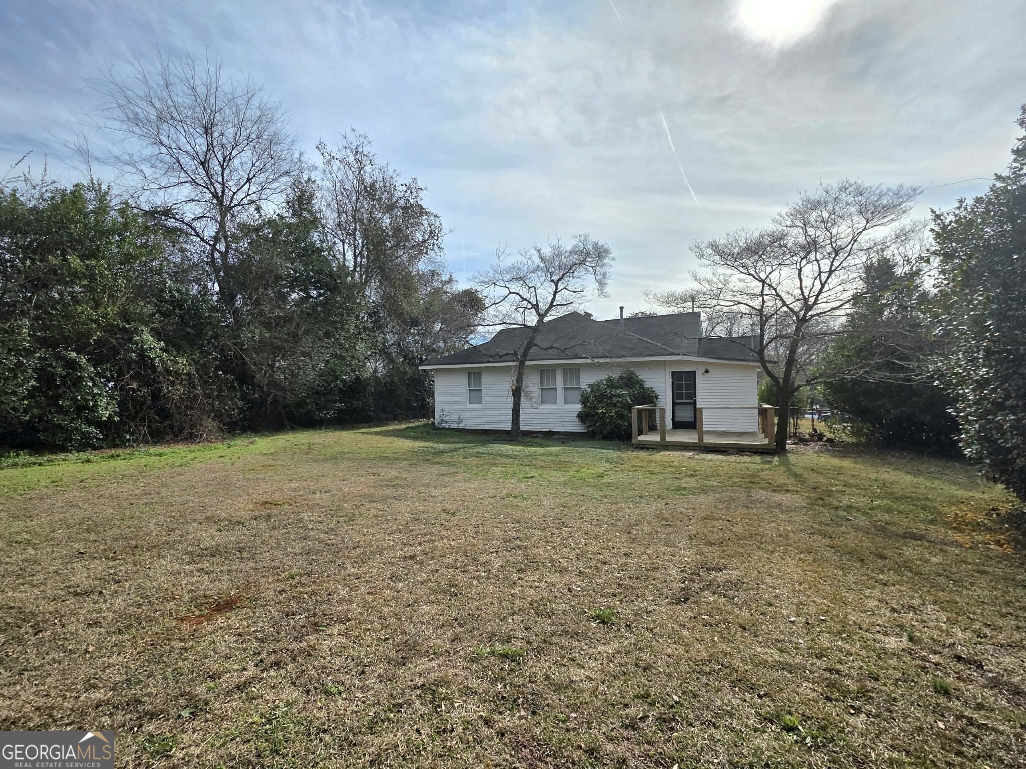 404 West Gordon Street Thomaston, GA 30286 - Photo 24 of 26 a view of a big house with a big yard and large trees