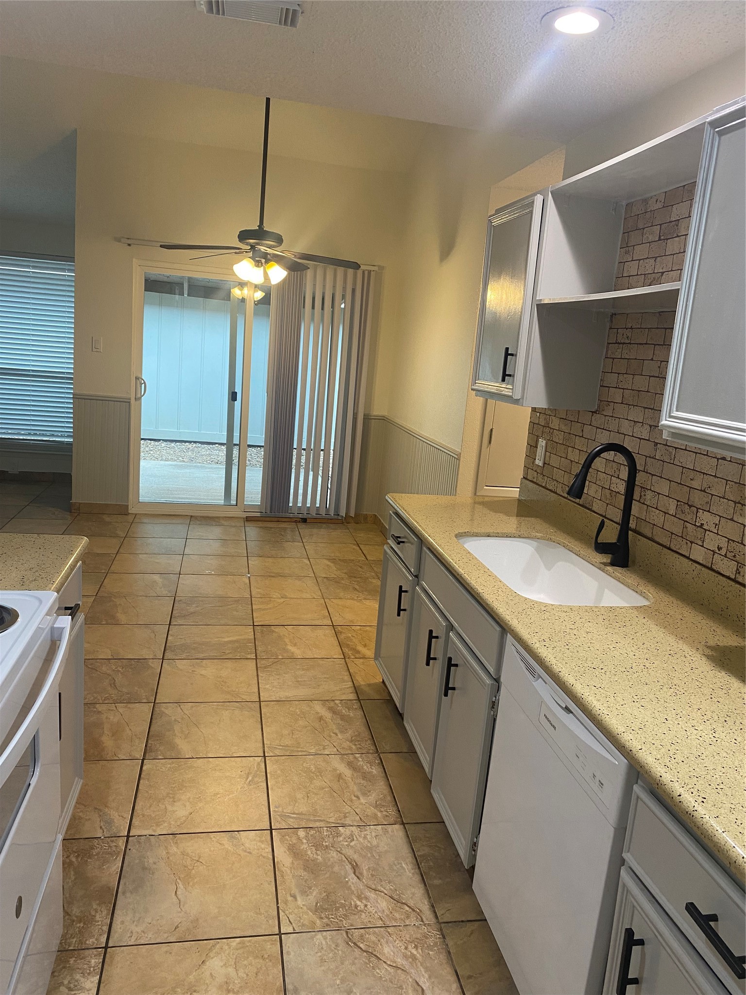 3107 Raccoon Run Spring, TX 77373 - Photo 28 of 35 Updated galley kitchen with new white granite sink and faucet