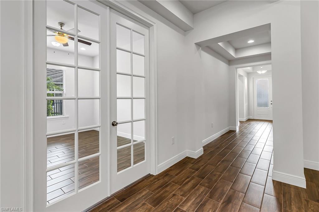 3668 Pilot Circle Naples, FL 34120 - Photo 11 of 29 a view of a hallway with wooden floor and entryway