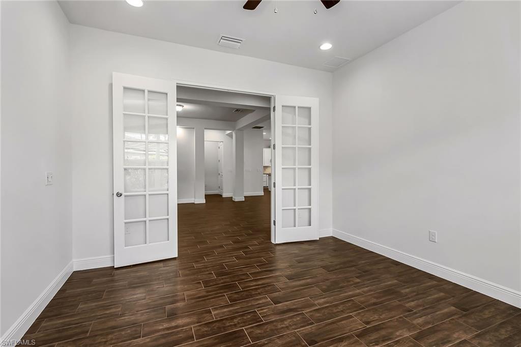 3668 Pilot Circle Naples, FL 34120 - Photo 12 of 29 wooden floor in an empty room