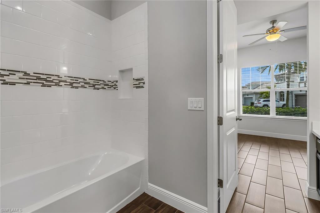 3668 Pilot Circle Naples, FL 34120 - Photo 15 of 29 a bathroom with a bathtub and a shower