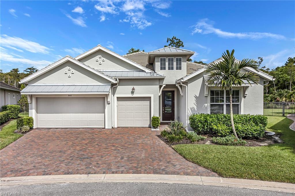 3668 Pilot Circle Naples, FL 34120 - Photo 2 of 29 front view of a house with a yard