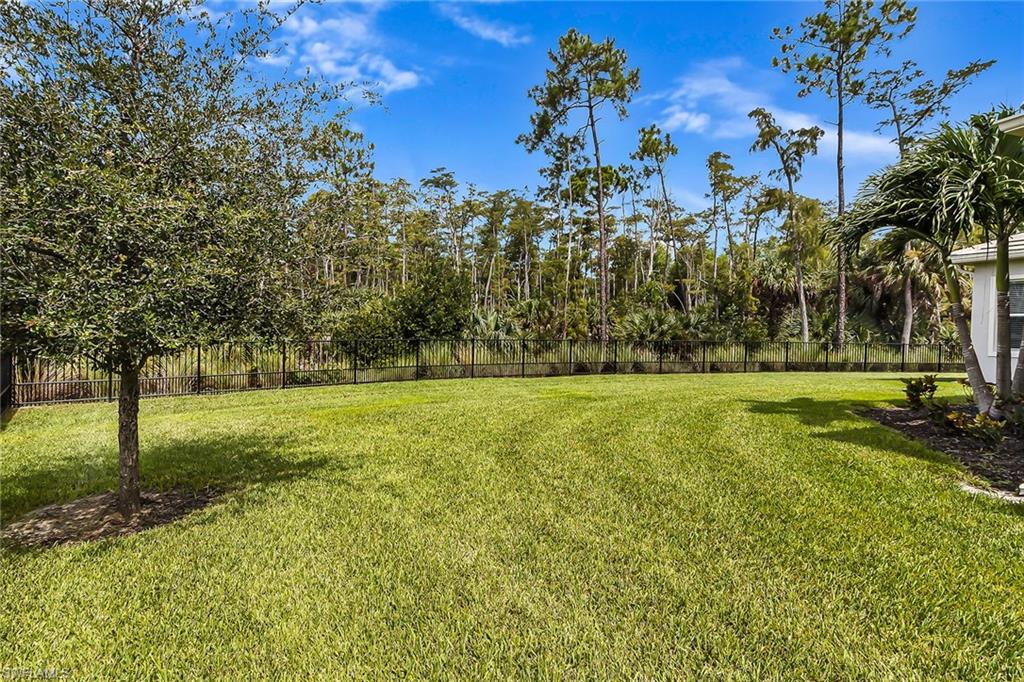 3668 Pilot Circle Naples, FL 34120 - Photo 21 of 29 a view of outdoor space with deck and yard