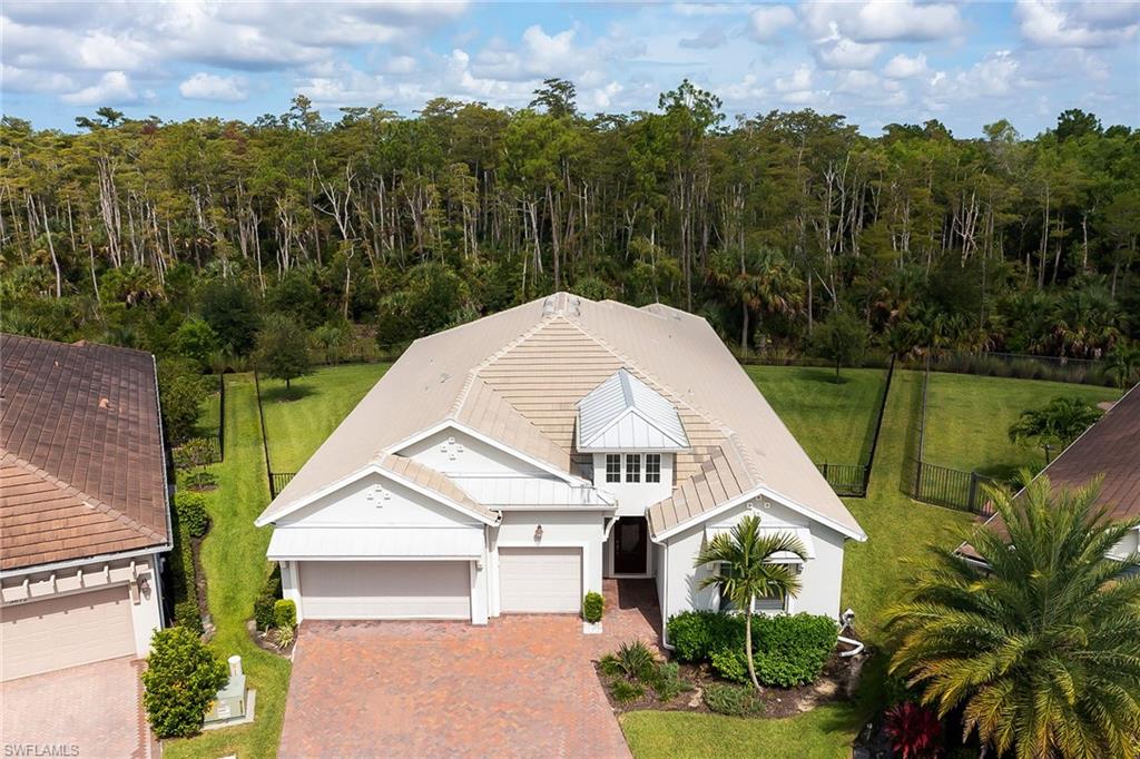 3668 Pilot Circle Naples, FL 34120 - Photo 23 of 29 a aerial view of a house with a yard and potted plants