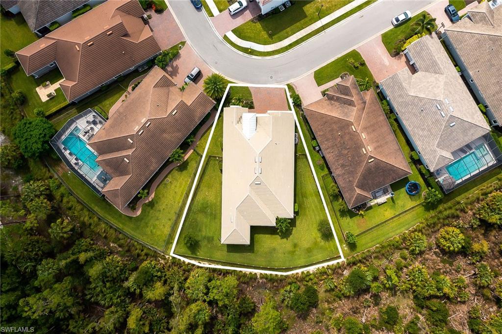 3668 Pilot Circle Naples, FL 34120 - Photo 26 of 29 an aerial view of a house with a swimming pool