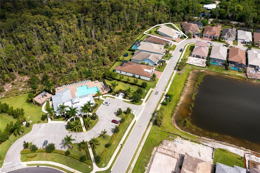3668 Pilot Circle Naples, FL 34120 - Photo 29 of 29 an aerial view of a house with a garden and lake view