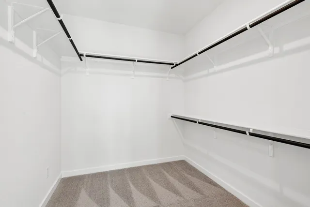a view of an empty walk in closet