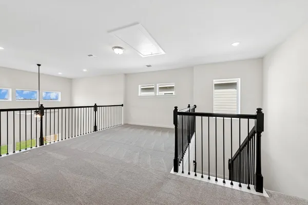a view of a hallway with windows
