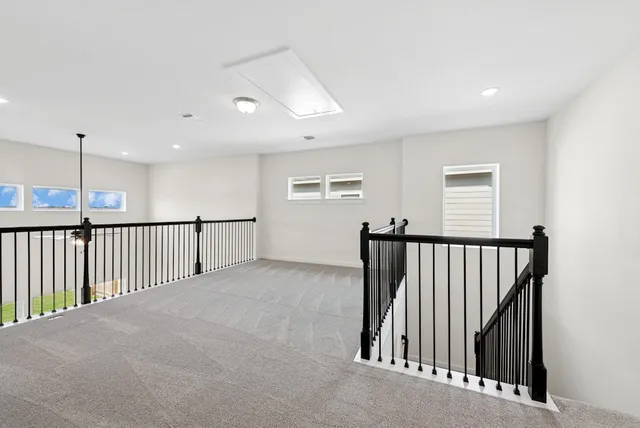 a view of a hallway with windows