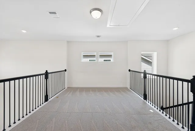 a view of a hallway with windows