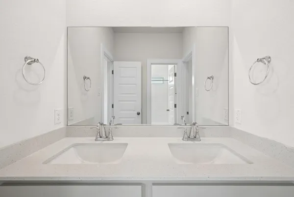 a bathroom with a sink vanity and tub