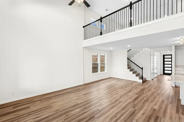 a view of an entryway with wooden floor