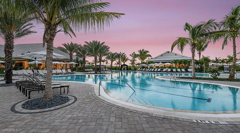 18073 Terracina Drive Fort Myers, FL 33913 - Photo 19 of 31 a swimming pool with outdoor seating and a potted plant