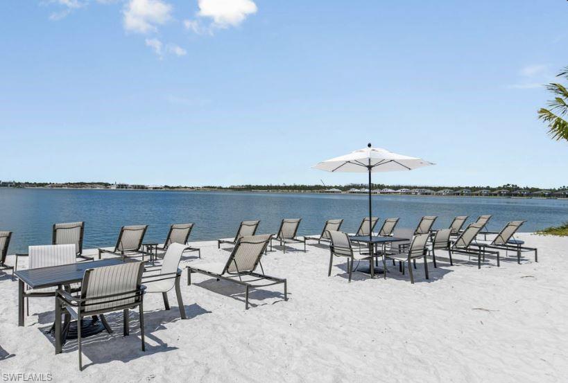 18073 Terracina Drive Fort Myers, FL 33913 - Photo 29 of 31 an outdoor space with furniture and umbrella
