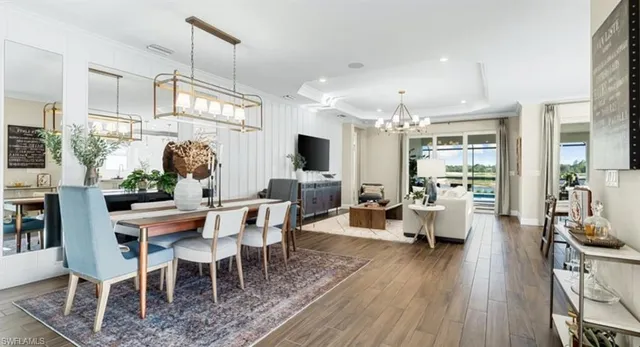 a utility room with cabinets washer and dryer