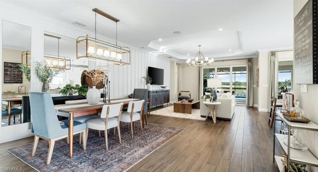 18073 Terracina Drive Fort Myers, FL 33913 - Photo 8 of 31 a view of a dining room with furniture wooden floor and chandelier