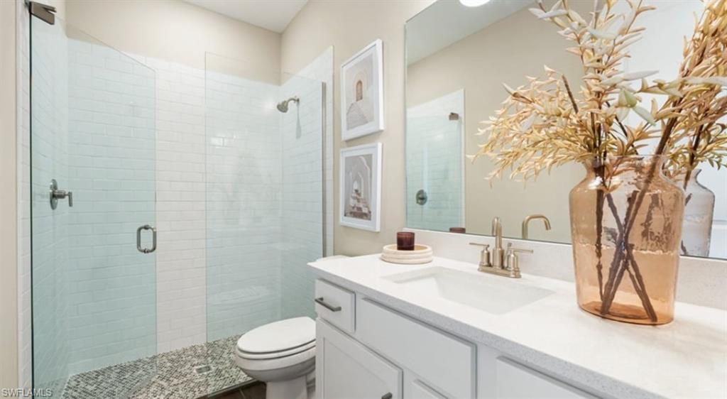 18073 Terracina Drive Fort Myers, FL 33913 - Photo 10 of 31 a bathroom with a sink toilet and shower
