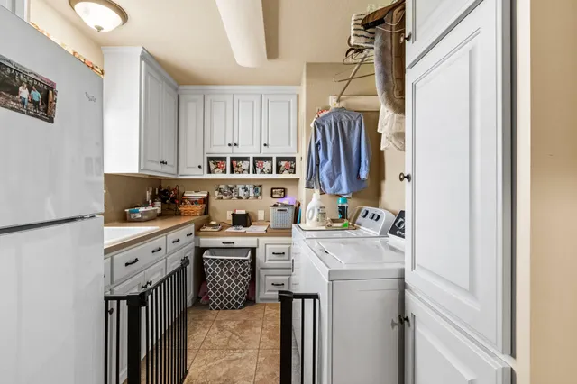 a kitchen with a sink a stove and cabinets
