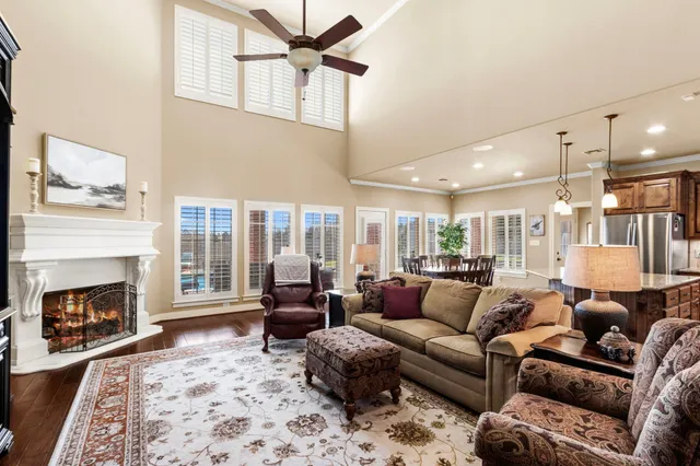 a living room with furniture window and a fireplace
