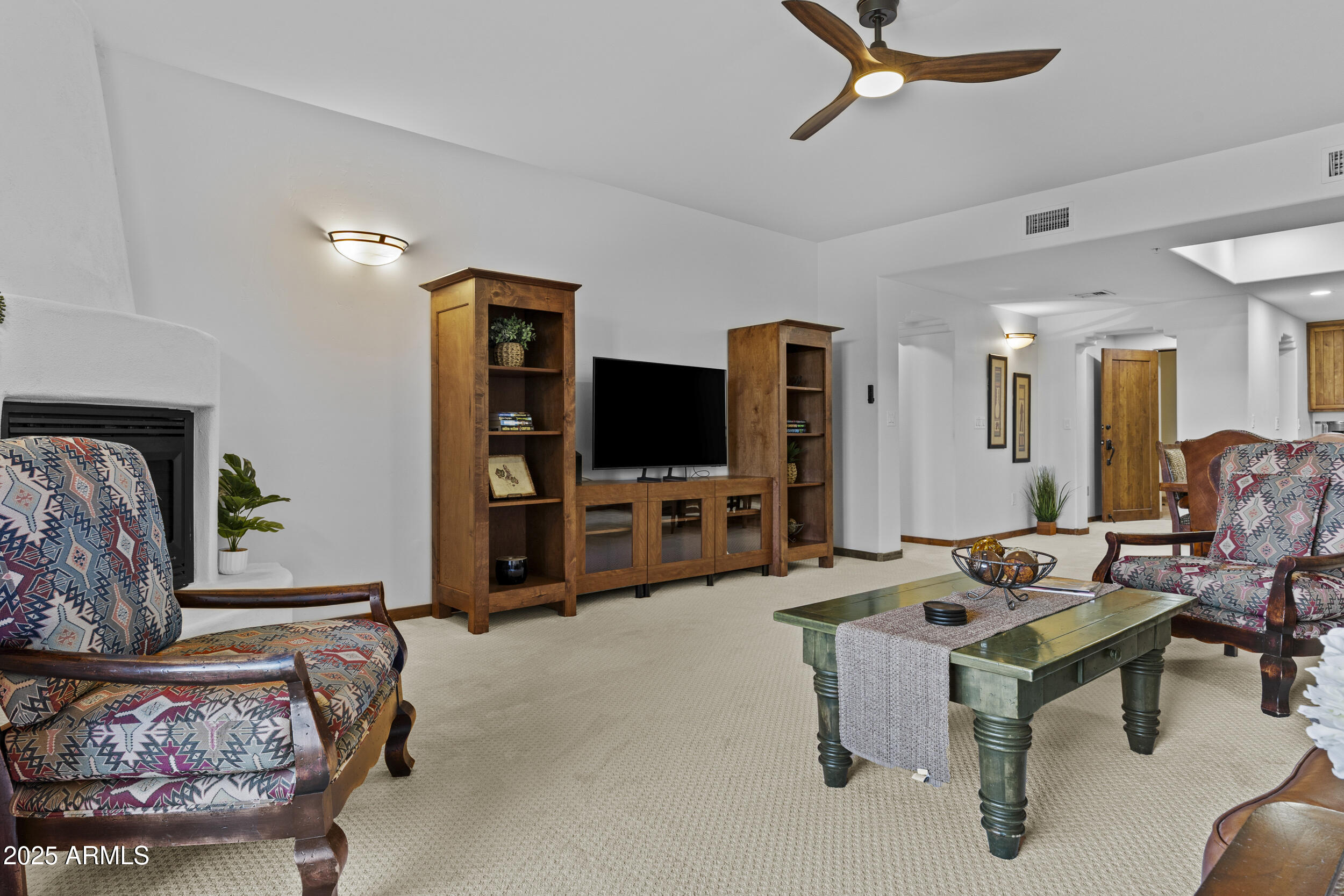 36601 North Mule Train Road, Unit D18 Carefree, AZ 85377 - Photo 19 of 57 a living room with furniture and a flat screen tv