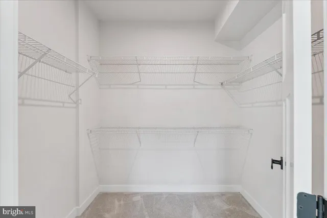 an empty room with closet area