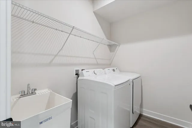 a bathroom with a sink toilet and mirror