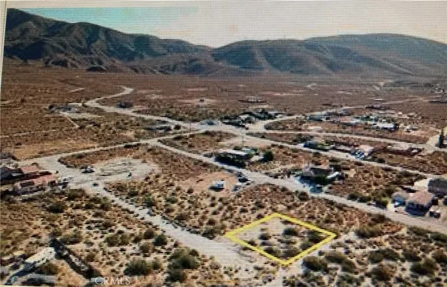 a view of a lake in middle of the forest