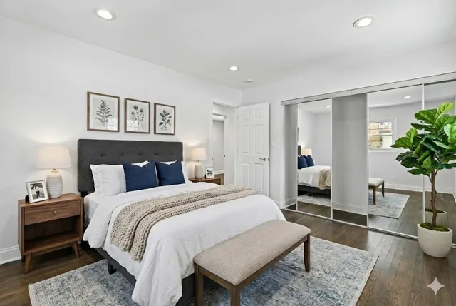 a bed room with a bed and a potted plant