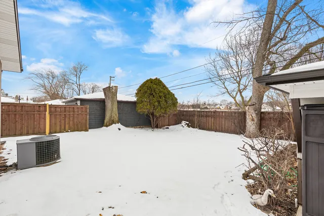 a view of a backyard of the house