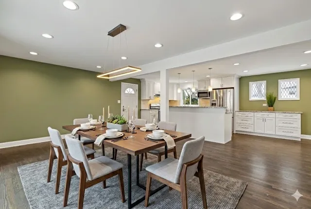 a dining room with furniture and wooden floor