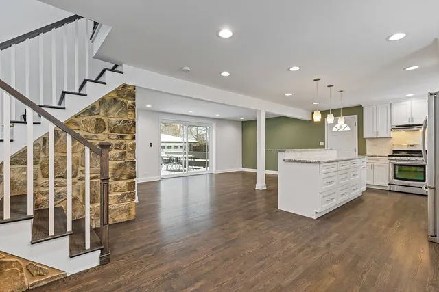 a view of kitchen with furniture and wooden floor