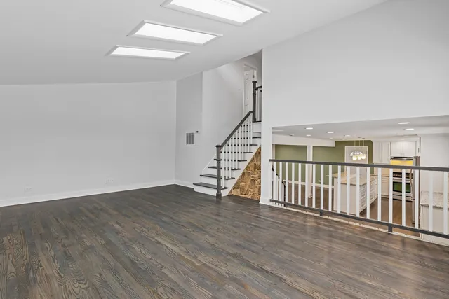 a view of an entryway with wooden floor