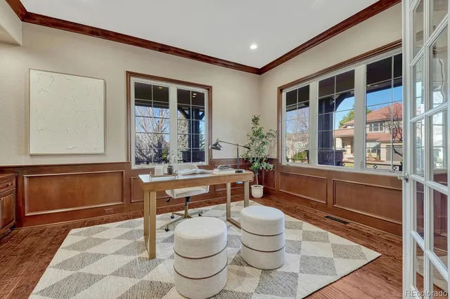 a room with wooden floor and furniture