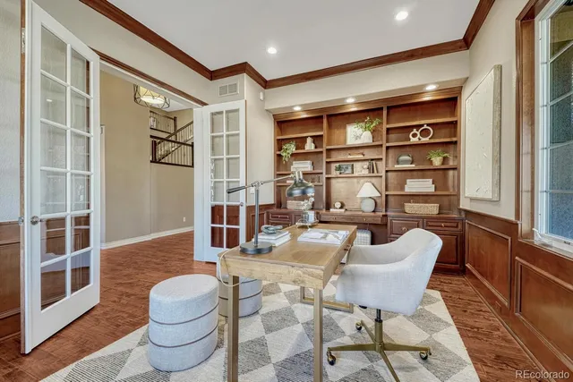 a living room with furniture a rug and a large window
