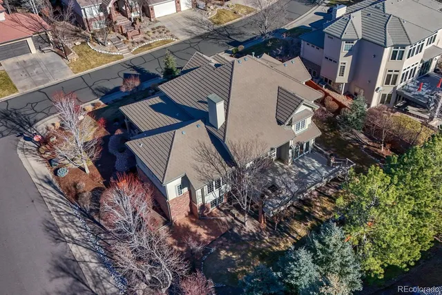 an aerial view of a house with a yard