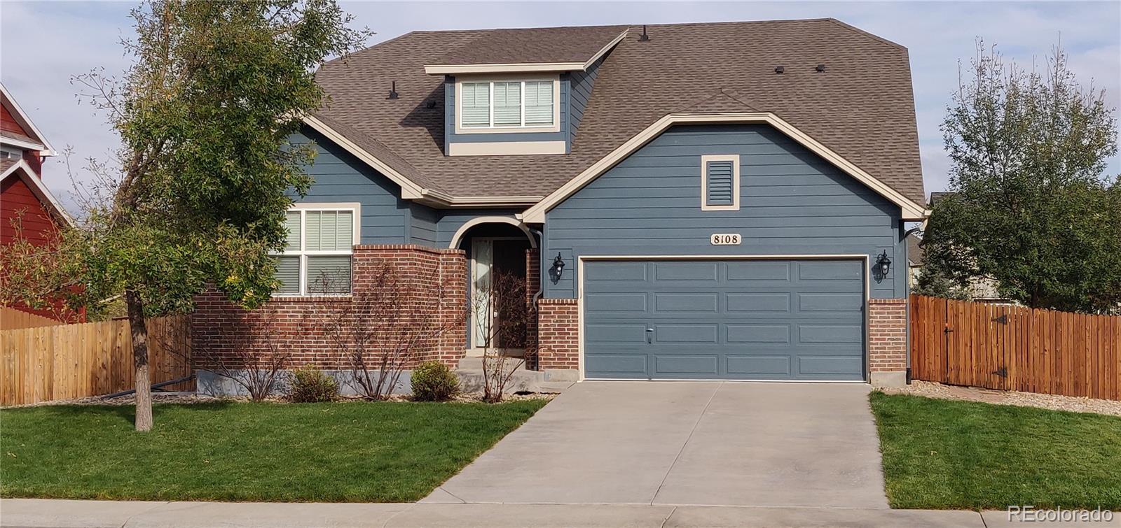 8108 Raspberry Drive Frederick, CO 80504 - Photo 1 of 16 a front view of a house with garden