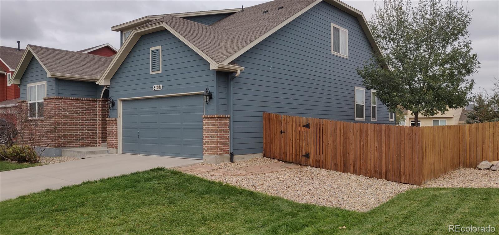 8108 Raspberry Drive Frederick, CO 80504 - Photo 3 of 16 a backyard of a house