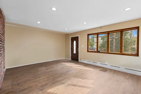 a view of an empty room with a window