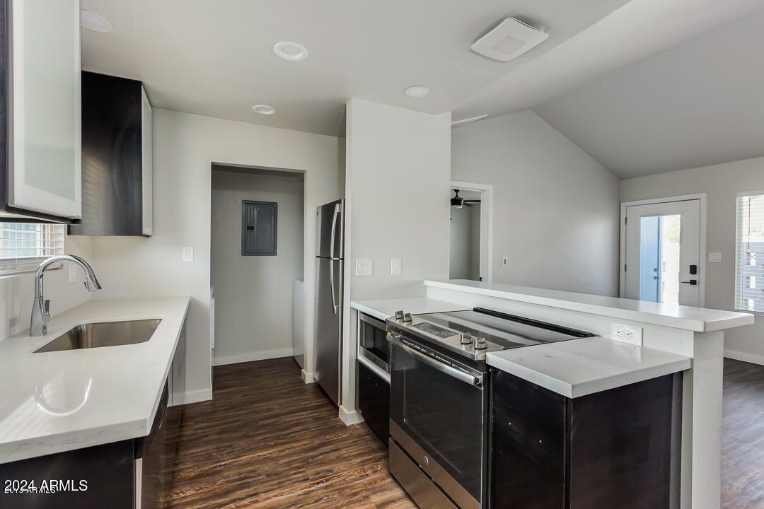 4229 North 17th Street Phoenix, AZ 85016 - Photo 10 of 20 a kitchen that has a sink and a stove