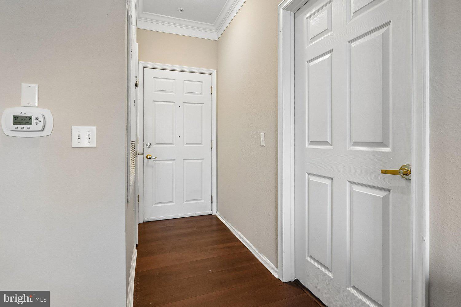 1521 Spring Gate Dr., Unit 10211 McLean, VA 22102 - Photo 3 of 56 a view of a hallway with wooden floor