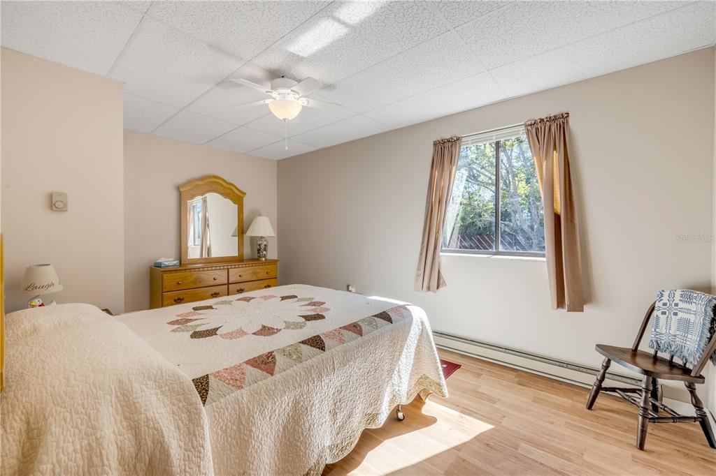 1981 South Merrick Drive Deltona, FL 32738 - Photo 18 of 30 a bedroom with a bed and a window