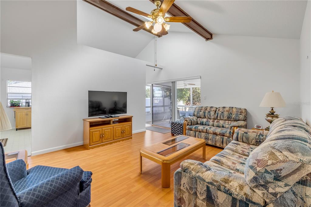 1981 South Merrick Drive Deltona, FL 32738 - Photo 6 of 30 a living room with furniture and a flat screen tv