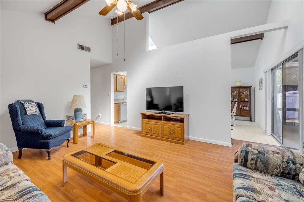 1981 South Merrick Drive Deltona, FL 32738 - Photo 7 of 30 a living room with furniture and a flat screen tv