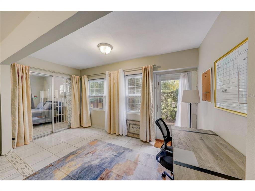 1433 South Belcher Road, Unit C1 Clearwater, FL 33764 - Photo 2 of 27 a view of a livingroom with furniture and windows
